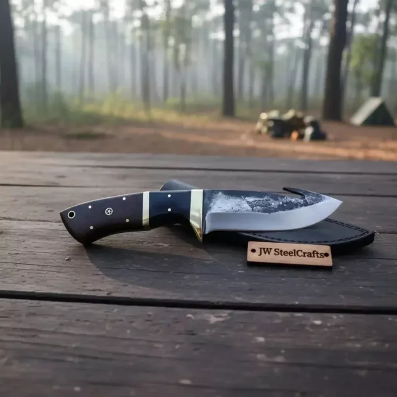 Gut hook knife with wood and brass handle